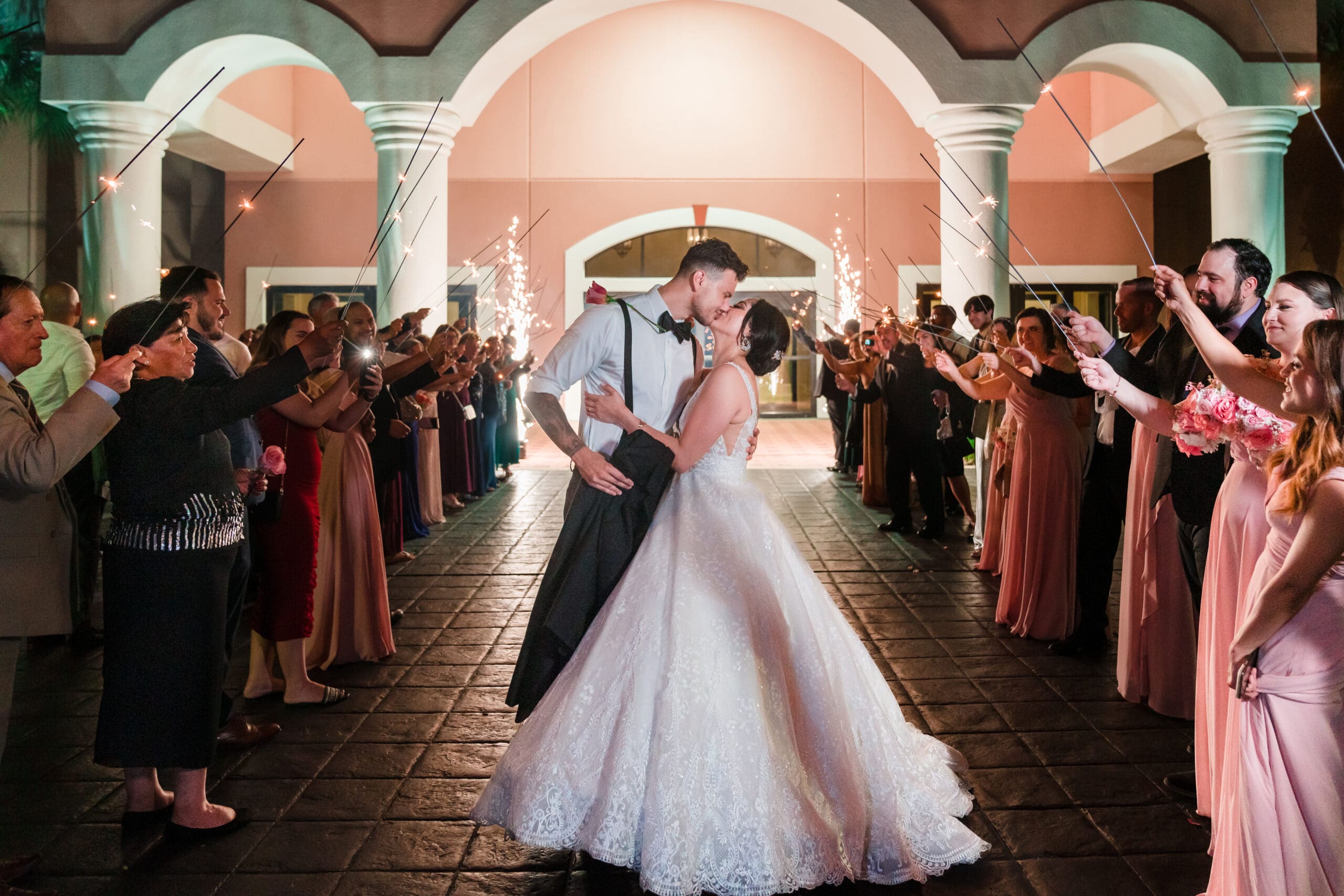 Jerzy Nieves Photography - Romantic moment captured as the bride and groom share a tender kiss, expressing their love and happiness at All Inclusive Weddings Orlando