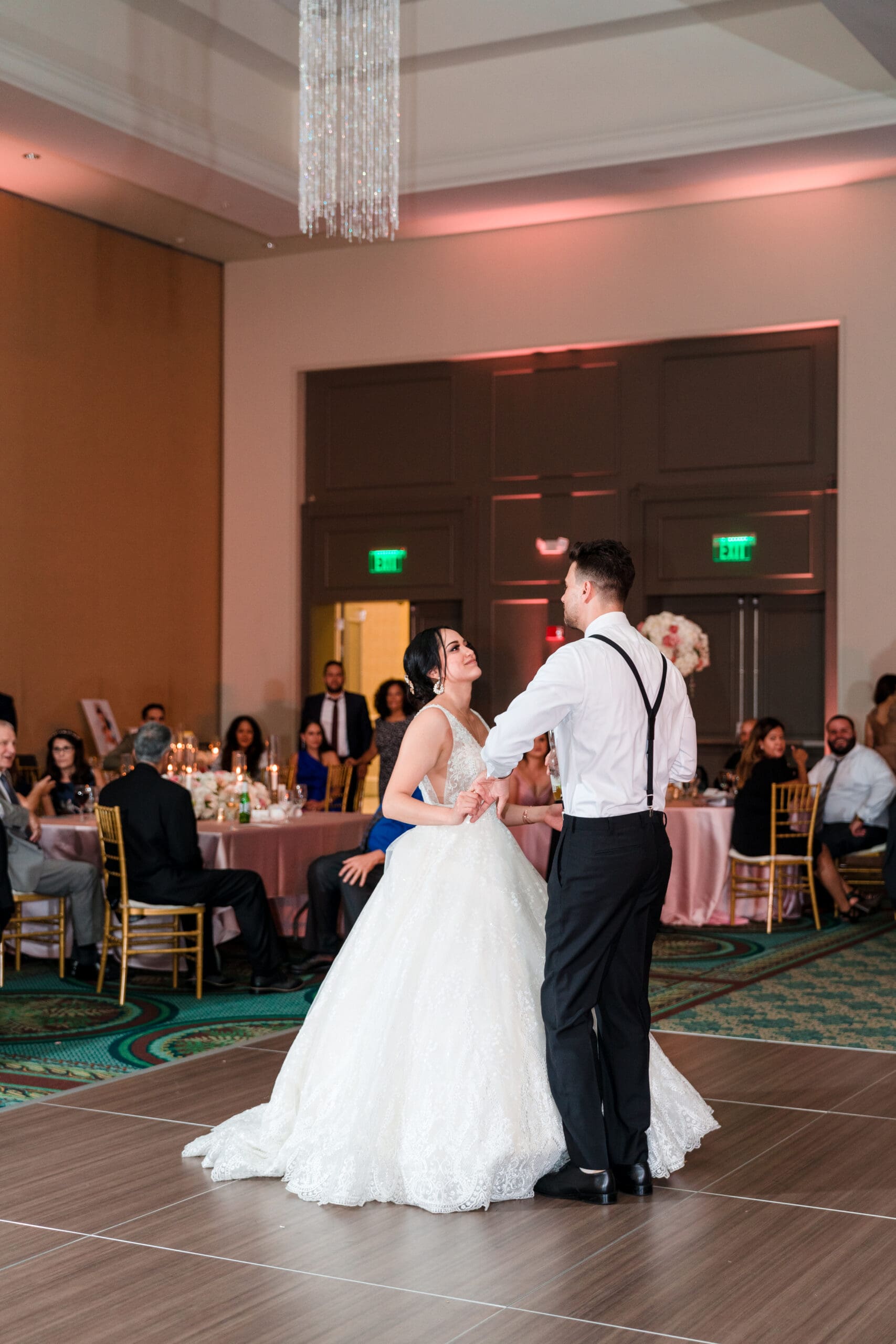 Tall shot capturing Jessica and Javier's first dance at the Orlando Royale Caribe reception center, beautifully photographed by Jerzy Nieves Photography.
