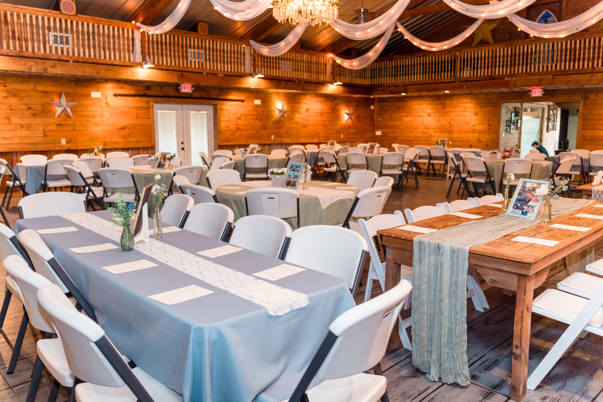 Tables set up at Hidden Barn reception center before Delisa and Preston's wedding reception