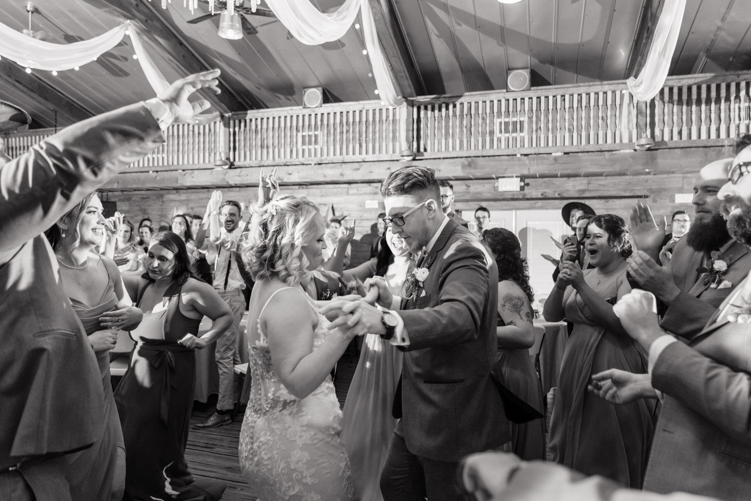 Black and white photo of Delisa and Preston's first dance at Hidden Barn Wedding Venue