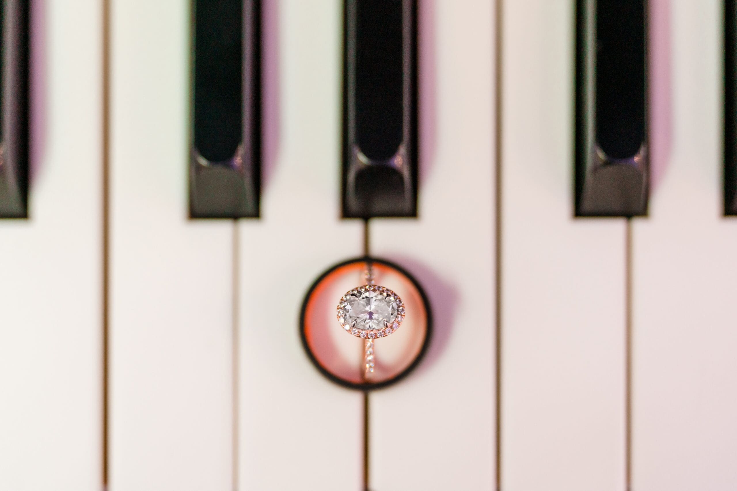 Close-up of Jenn's ring on piano keys.