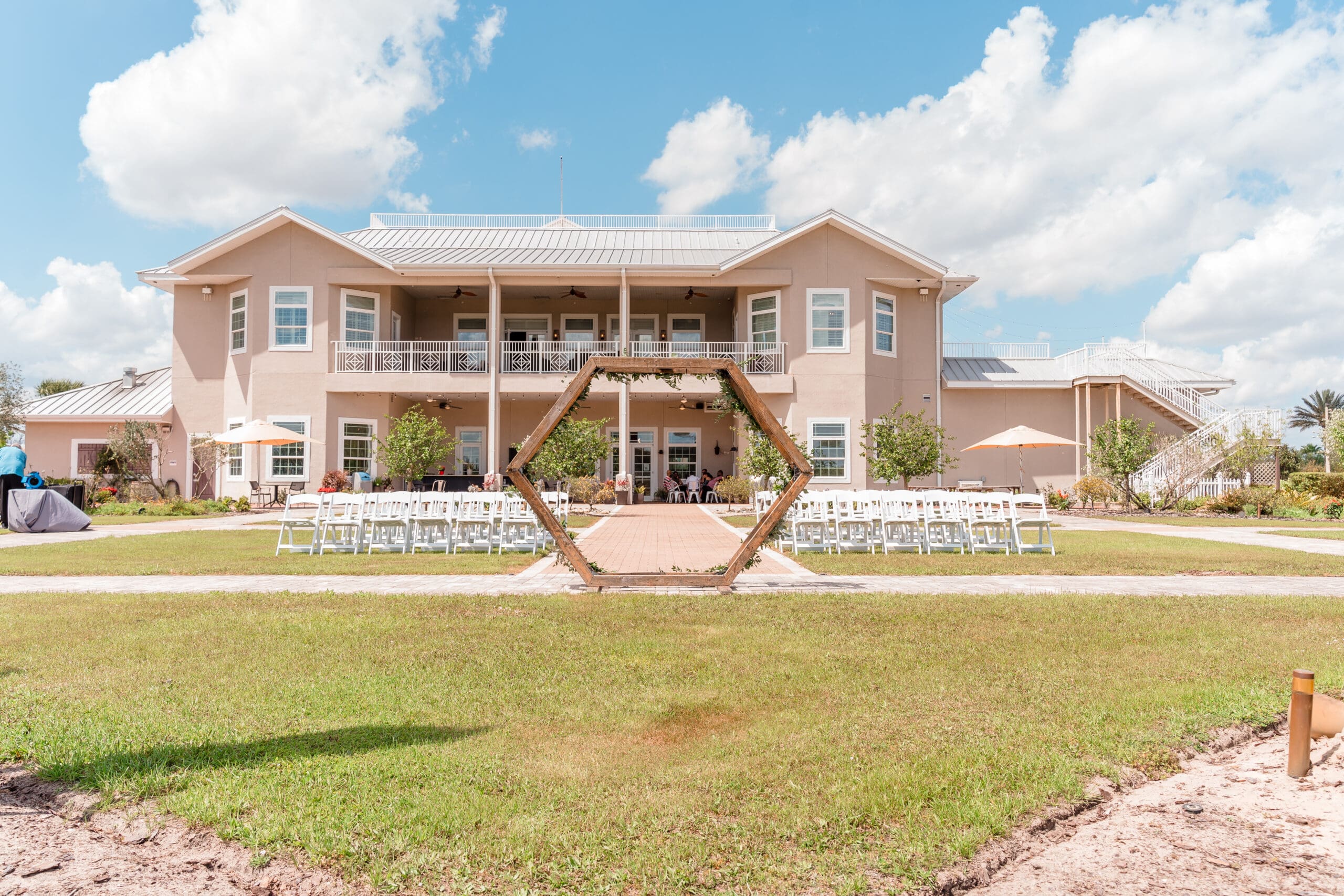 Ground view of the outdoor wedding altar and guest chairs at Island Grove Recreational Center.