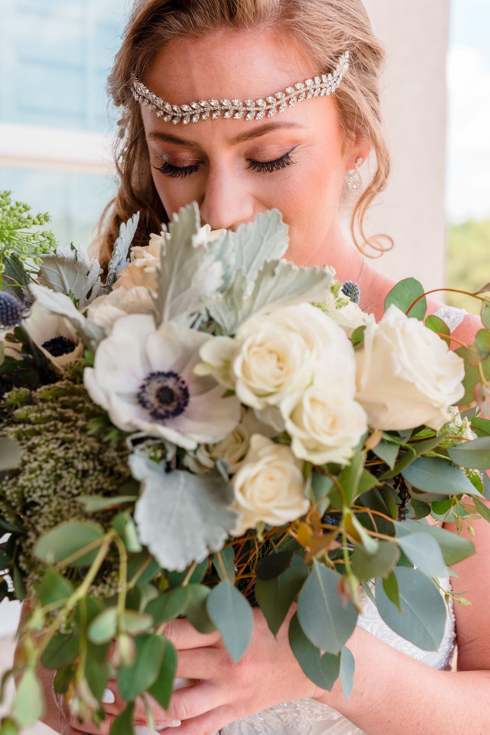 Close-up of Kristen Smelling Wedding Bouquet on Balcony of Island Grove Recreation Center