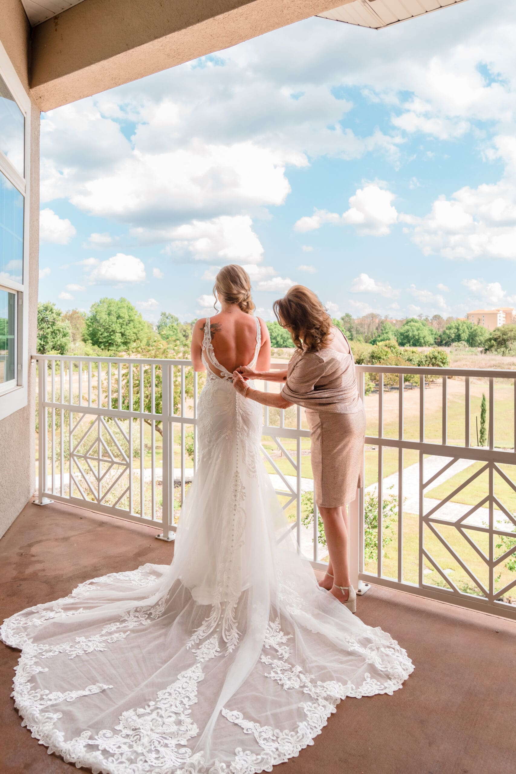 Kristen's Mom Zipping Up Her Wedding Dress on Balcony