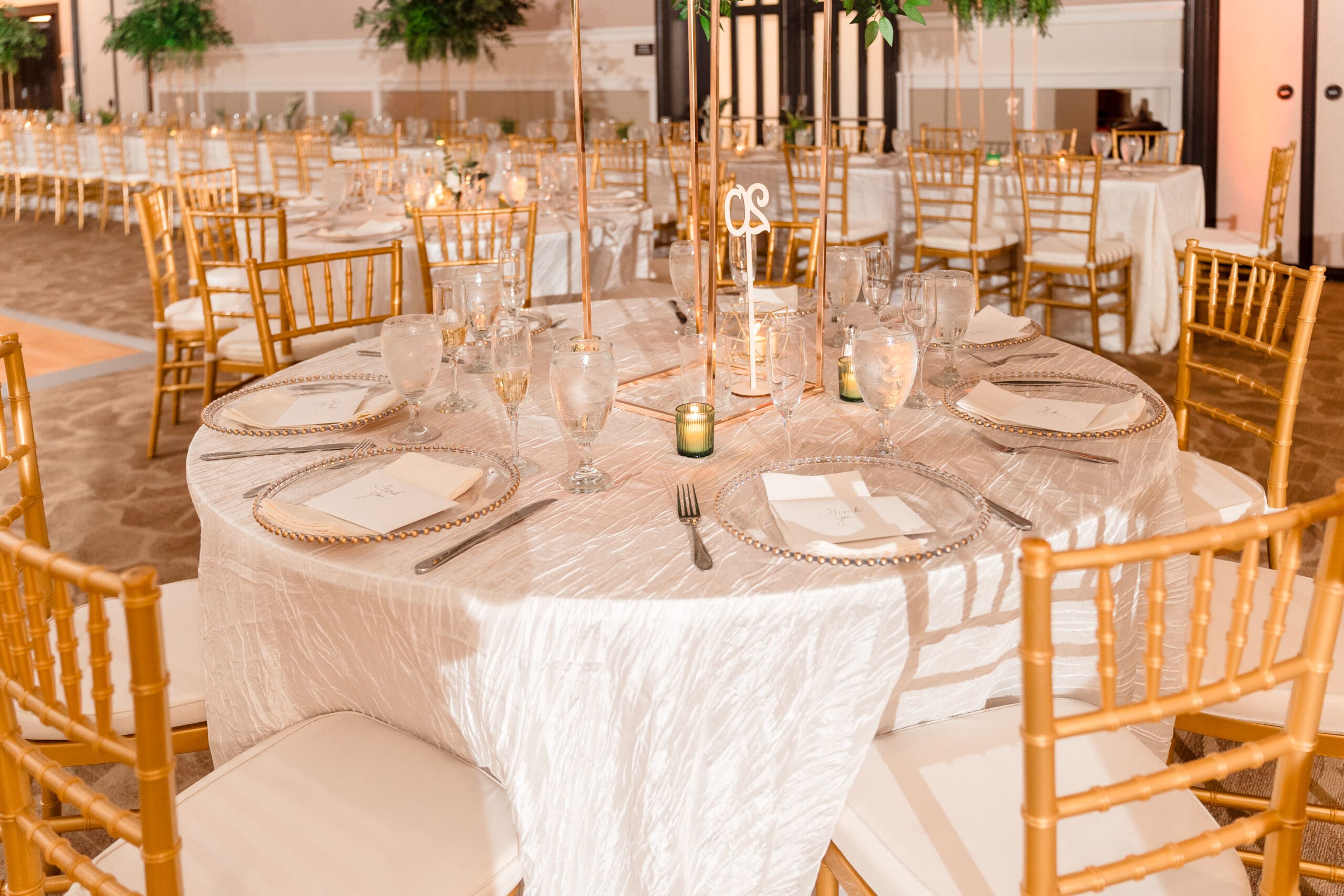 Close-up of elegant guest table settings at Glen and Lateisha's wedding at Ocoee Lakeshore Center.