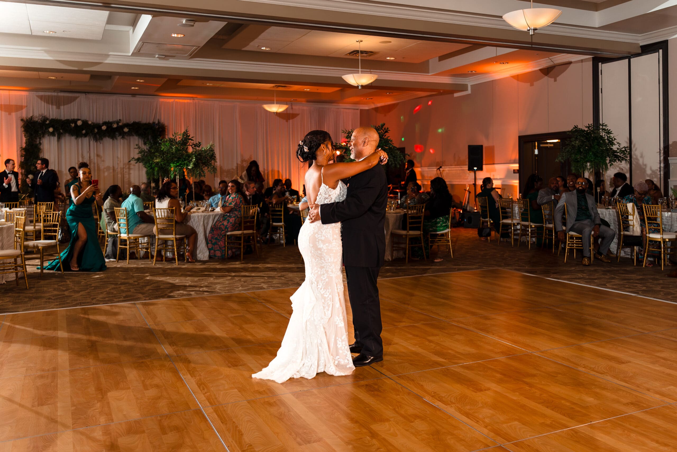 Wide shot of Lateisha dancing with her father at Ocoee Lakeshore Reception Center.