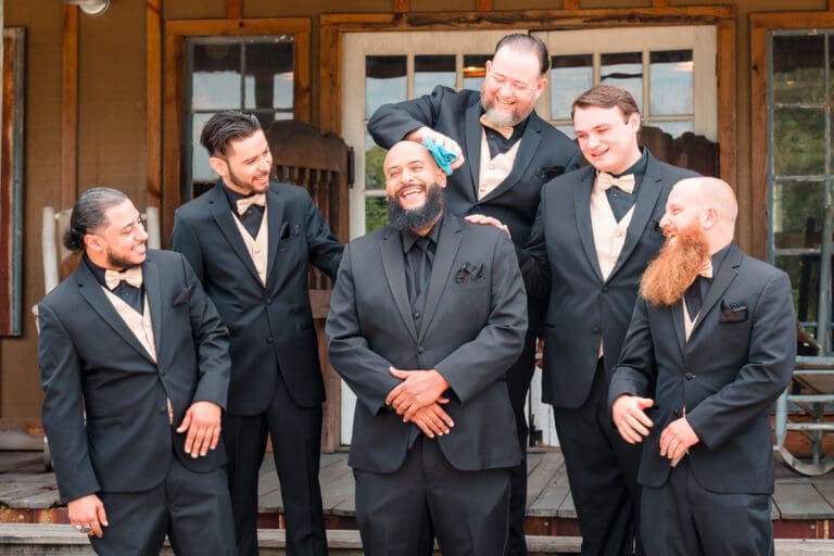 Groomsmen Laughing and Best Man Shining Groom's Head at Hidden Barn