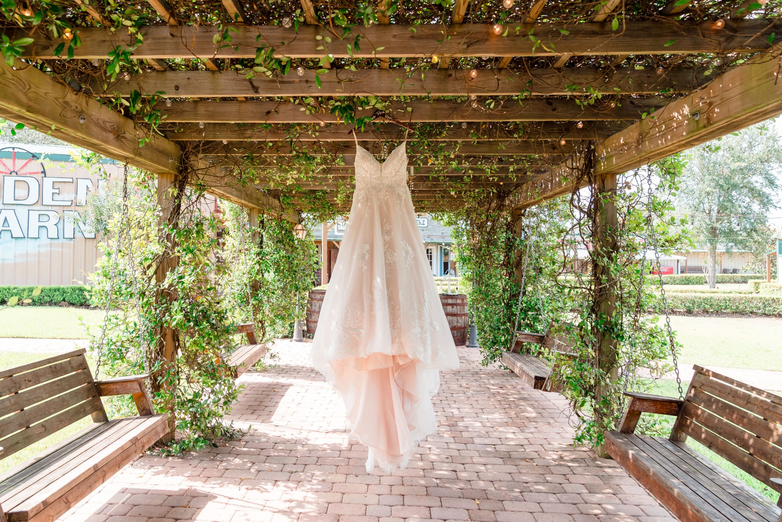 Bride's Wedding Dress Hanging at Hidden Barn Venue