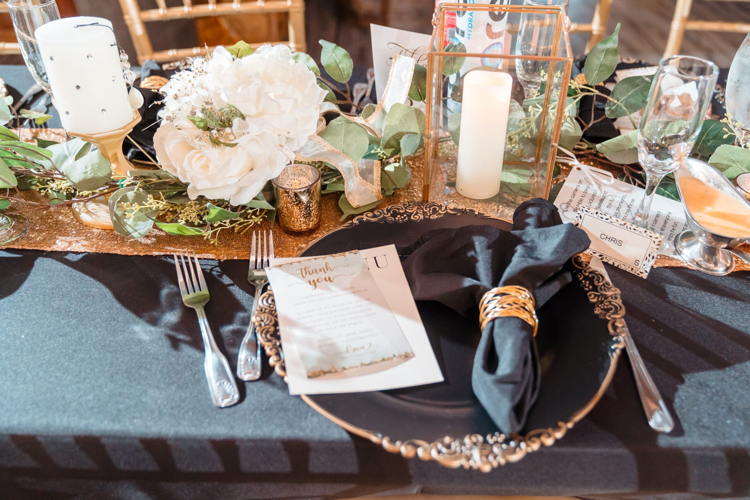 Close-up of elegant table decorations at Taylor and David's wedding reception at the Hidden Barn