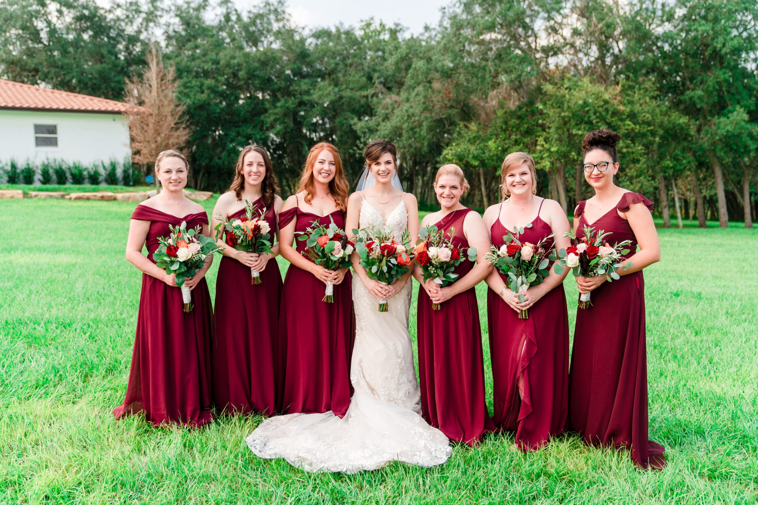 Bethany and her bridesmaids holding flowers in the Sterling Event Venue Garden.