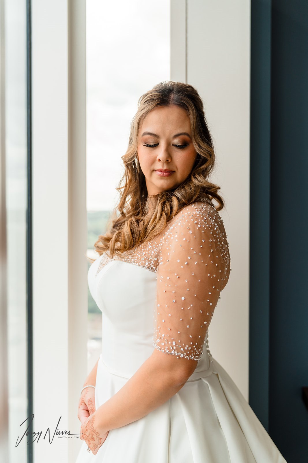 Close-up shot of Nicole in her wedding attire, captured by Jerzy Nieves in the Disney Swan Reserve Bridal Suite.