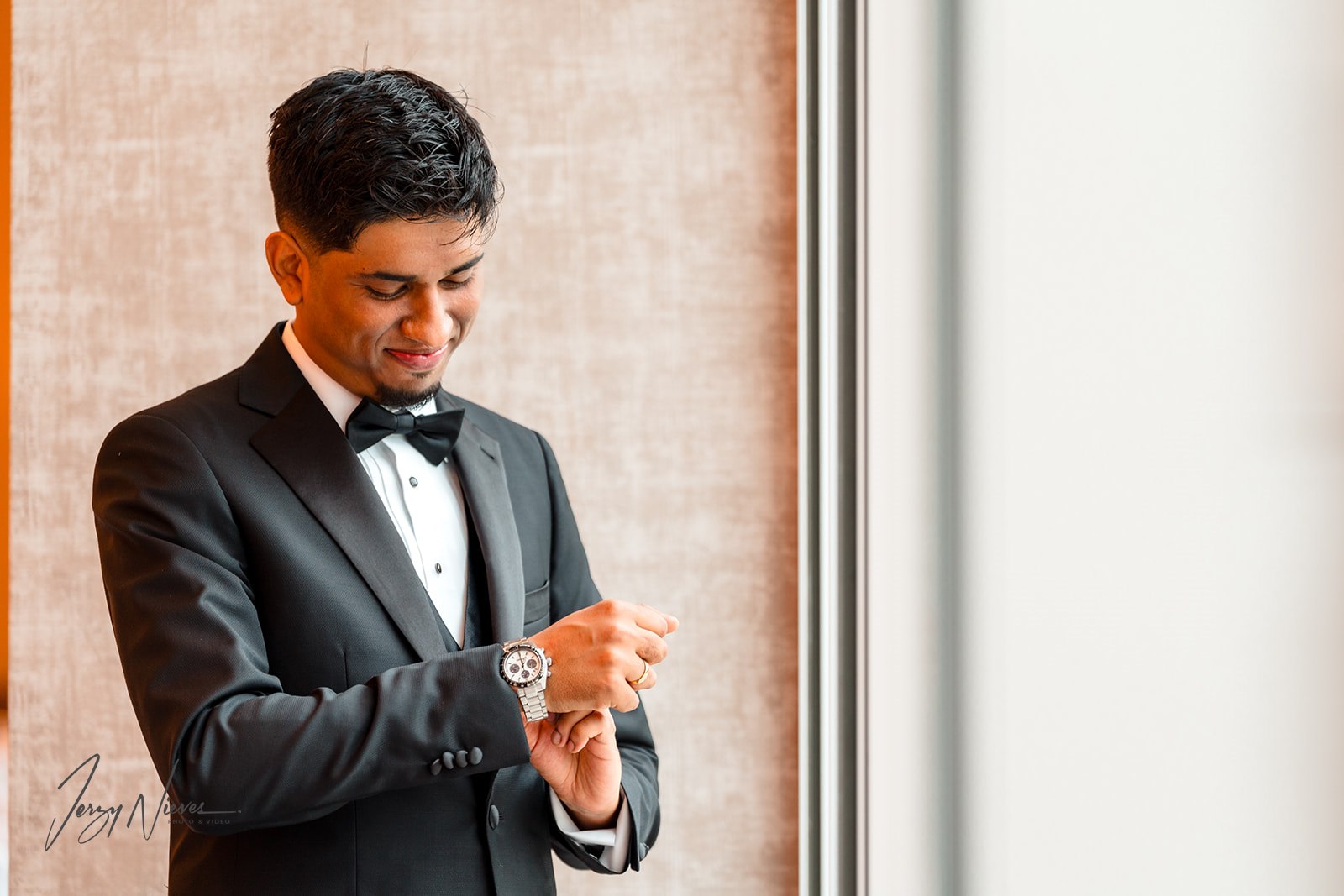 Ravin Adjusting His Watch in Traditional Tuxedo - Disney Swan Reserve Pre-Wedding