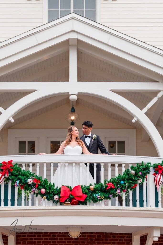 Nicole and Ravin locked in a loving gaze on the balcony of Disney Swan Reserve.