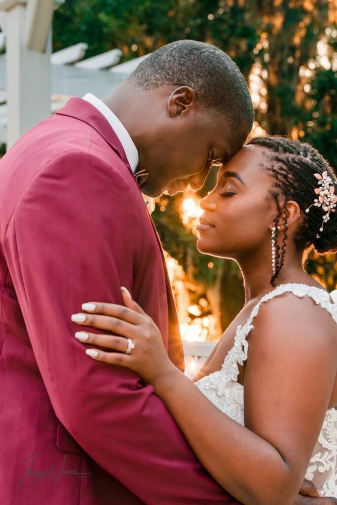 Close-up of the couple embracing under the walkway at Lake Mary Event Center