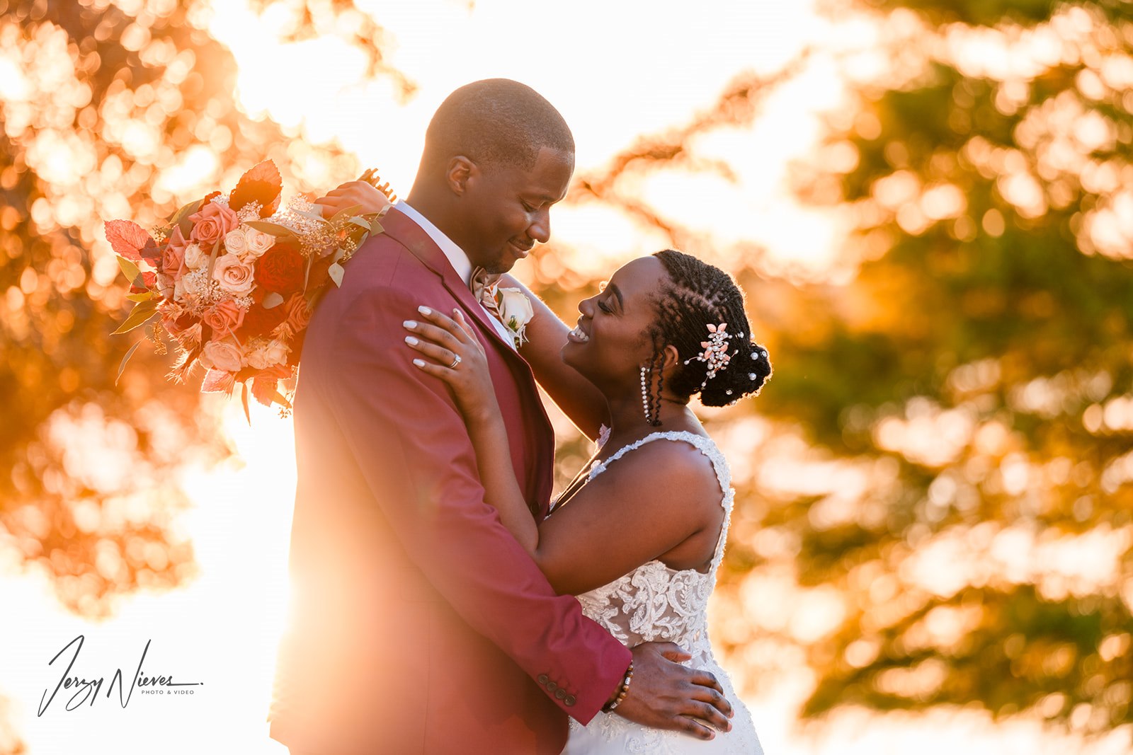 Jerzy Nieves Photography - Stylishly dressed bride and groom sharing a passionate kiss, showcasing their love and fashion-forward elegance at All Inclusive Weddings Orlando