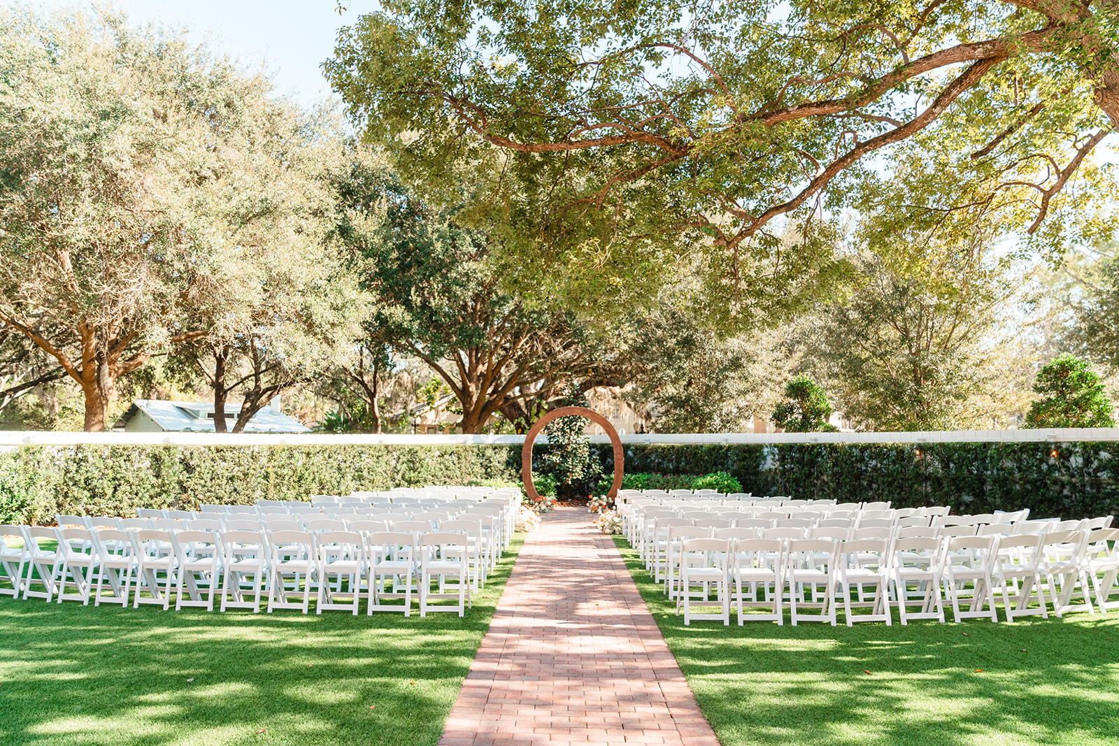 Empty ceremony area in the garden at Venue 1902, showcasing its elegant setting before the wedding.