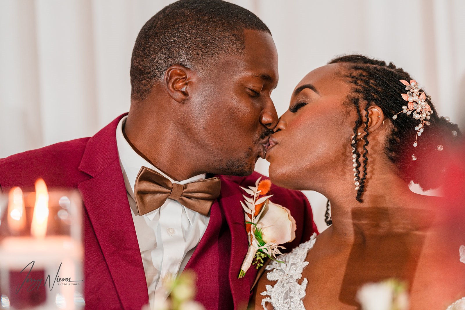 Close-up of the couple, Javon and Shelby, kissing at Lake Mary Reception Hall