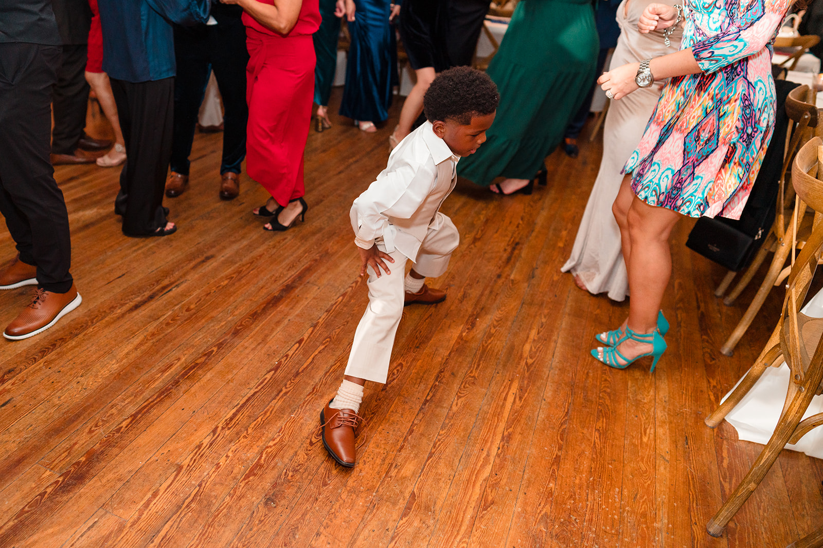 Young guest showcasing impressive dance moves on the reception dance floor at Venue 1902.