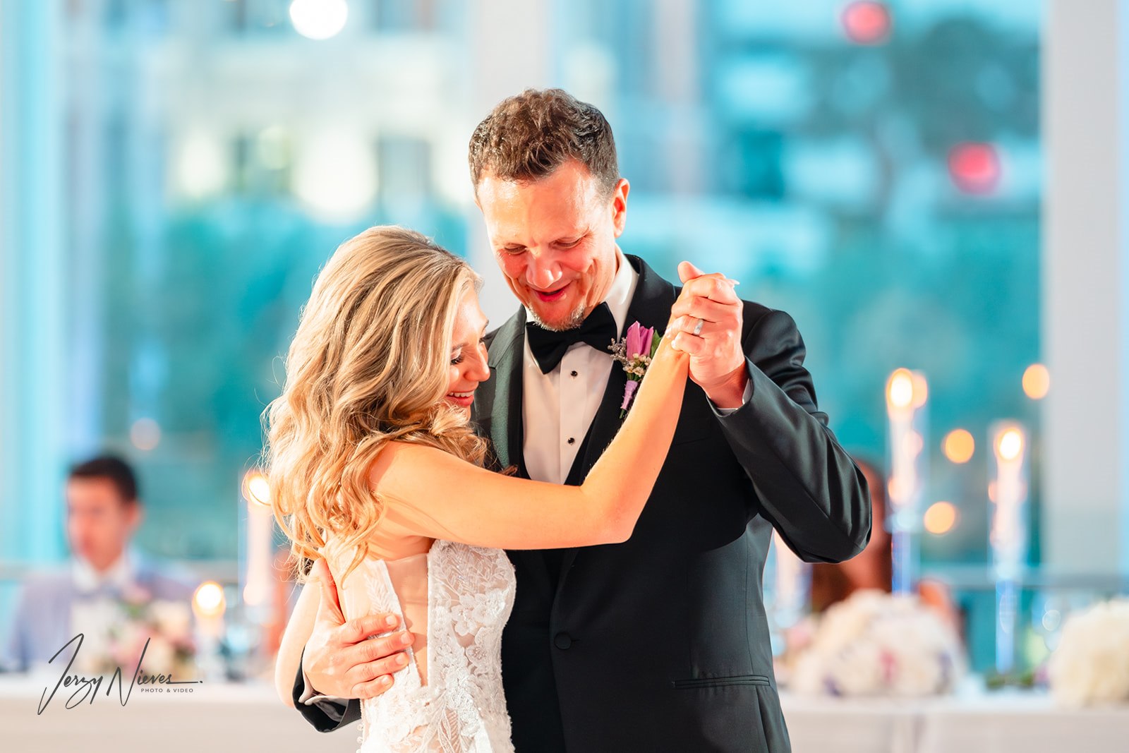 Bride dancing with her father during the reception, surrounded by guests at the Dr. Phillips Center for Performing Arts.
