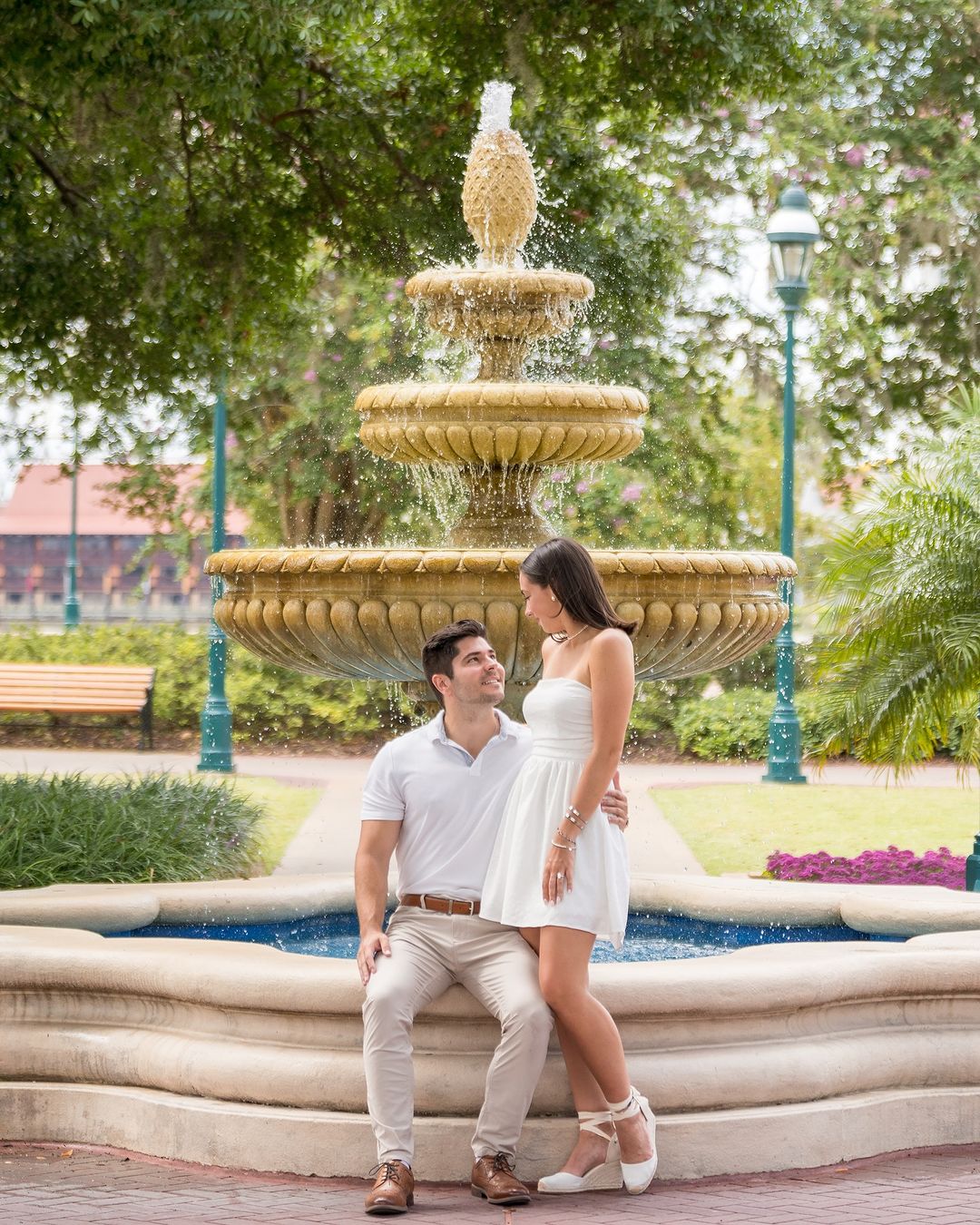 Captivating proposal moment: Girl in shock with her jaw dropped as he gets on his knee to ask the question, with the Disney castle in the background, creating an amazing photo shoot.