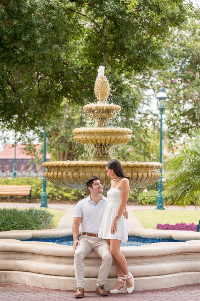 Engagement session of a couple in front of a fountain in Orlando, captured by Jerzy Nieves Photography