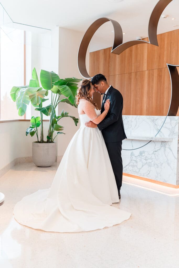 Bride and groom sharing a kiss in front of Disney World's iconic castle