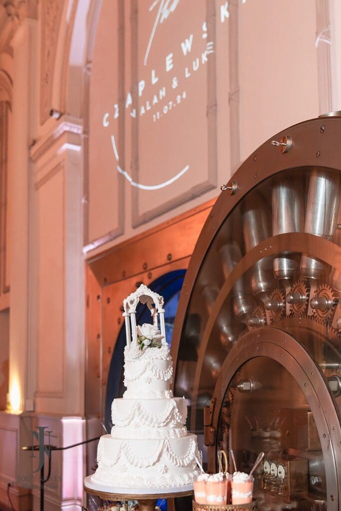 3 tier wedding cake by vault door