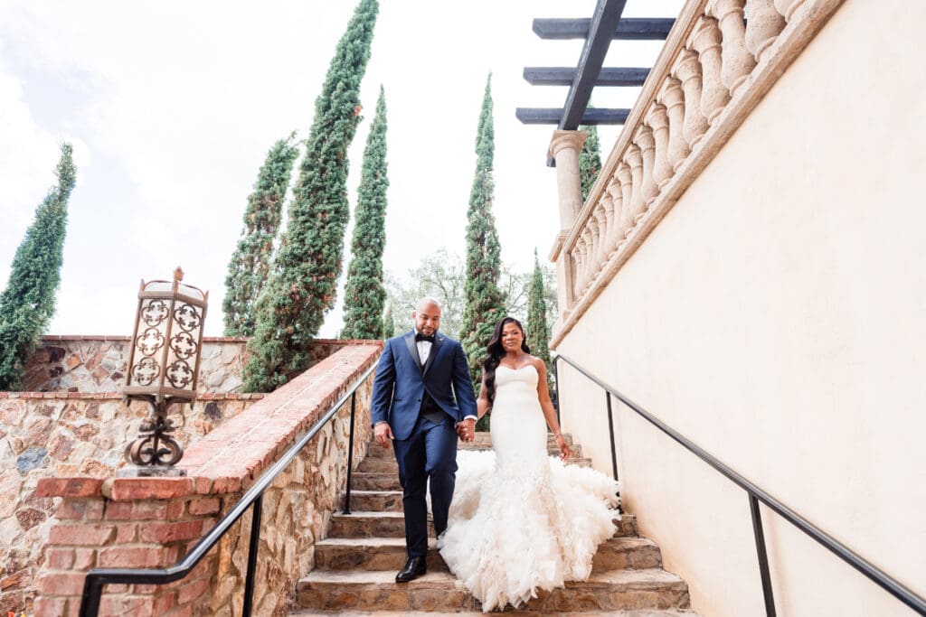 Bride and groom at Bella Collina wedding venue in Orlando, Florida, posing during golden hour on the grand lawn.