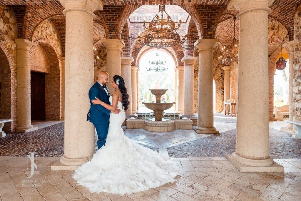 bride and groom hugging in atrium at Bella Collina, Orlando, FL