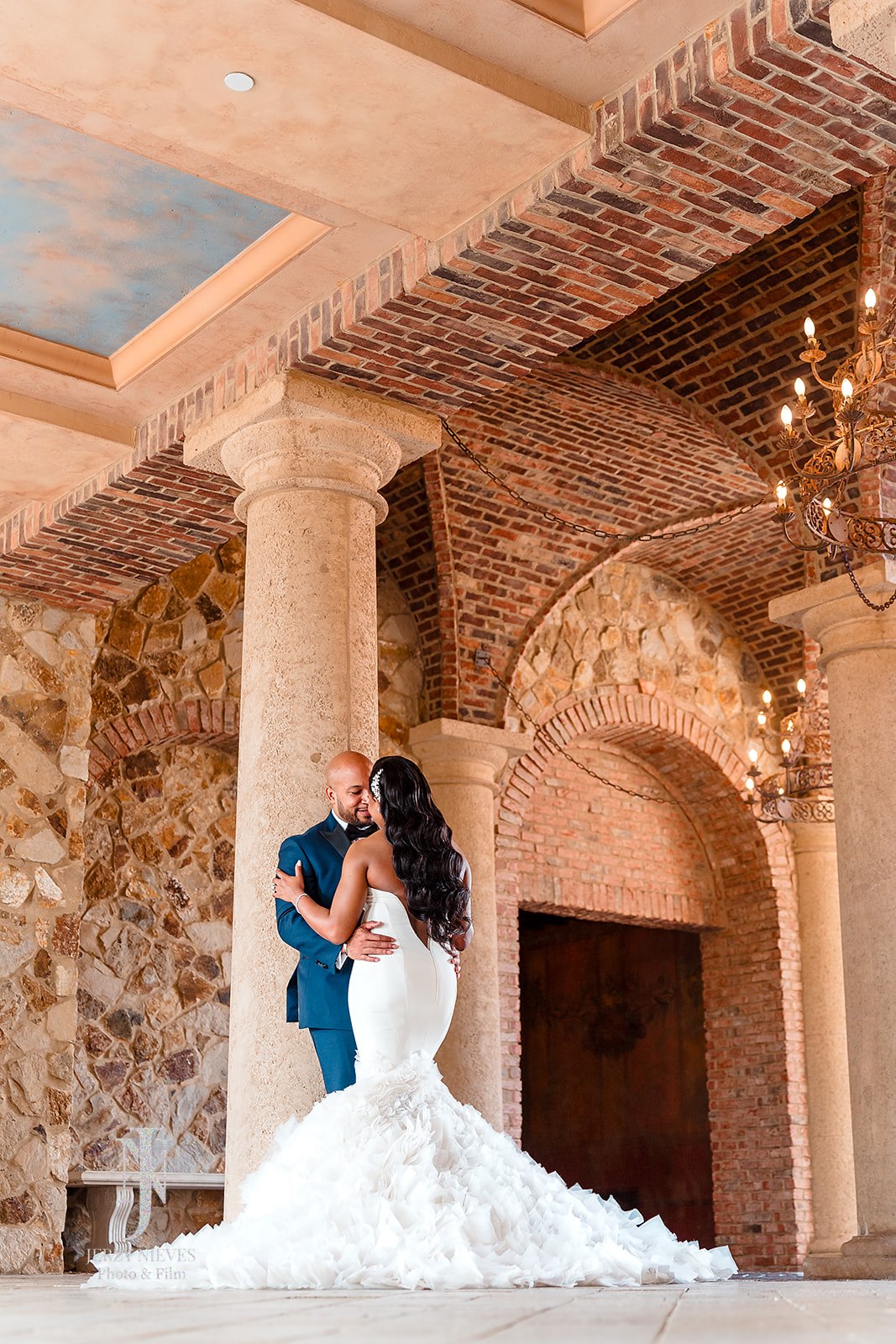 bride and groom hugging in atrium at luxury wedding venue in Orlando