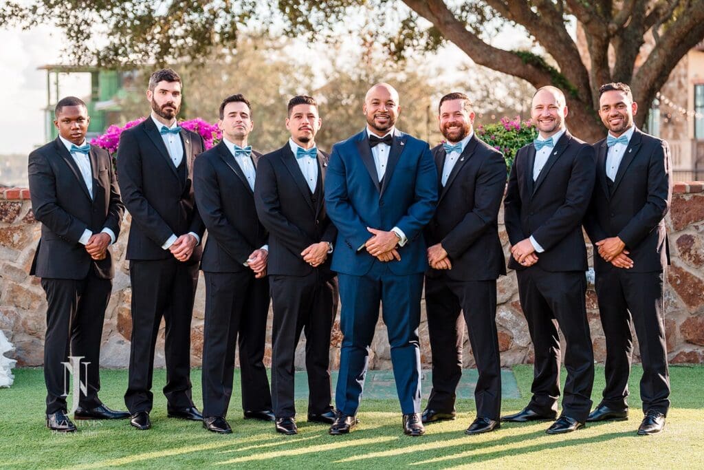 grooms and groomsmen wearing navey and blue suits