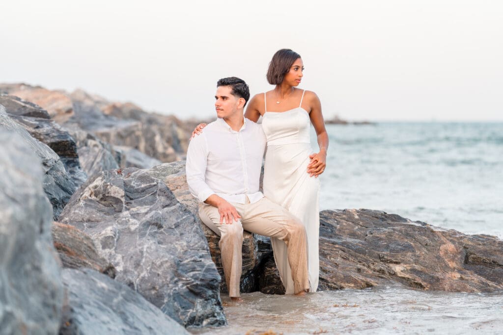 Marissa laughing during engagement photos at Jetty Park Beach in Cocoa, FL