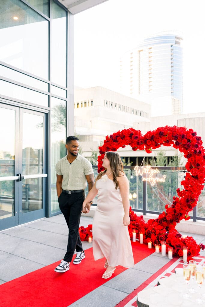 Candid engagement photos after a surprise proposal in Downtown Orlando