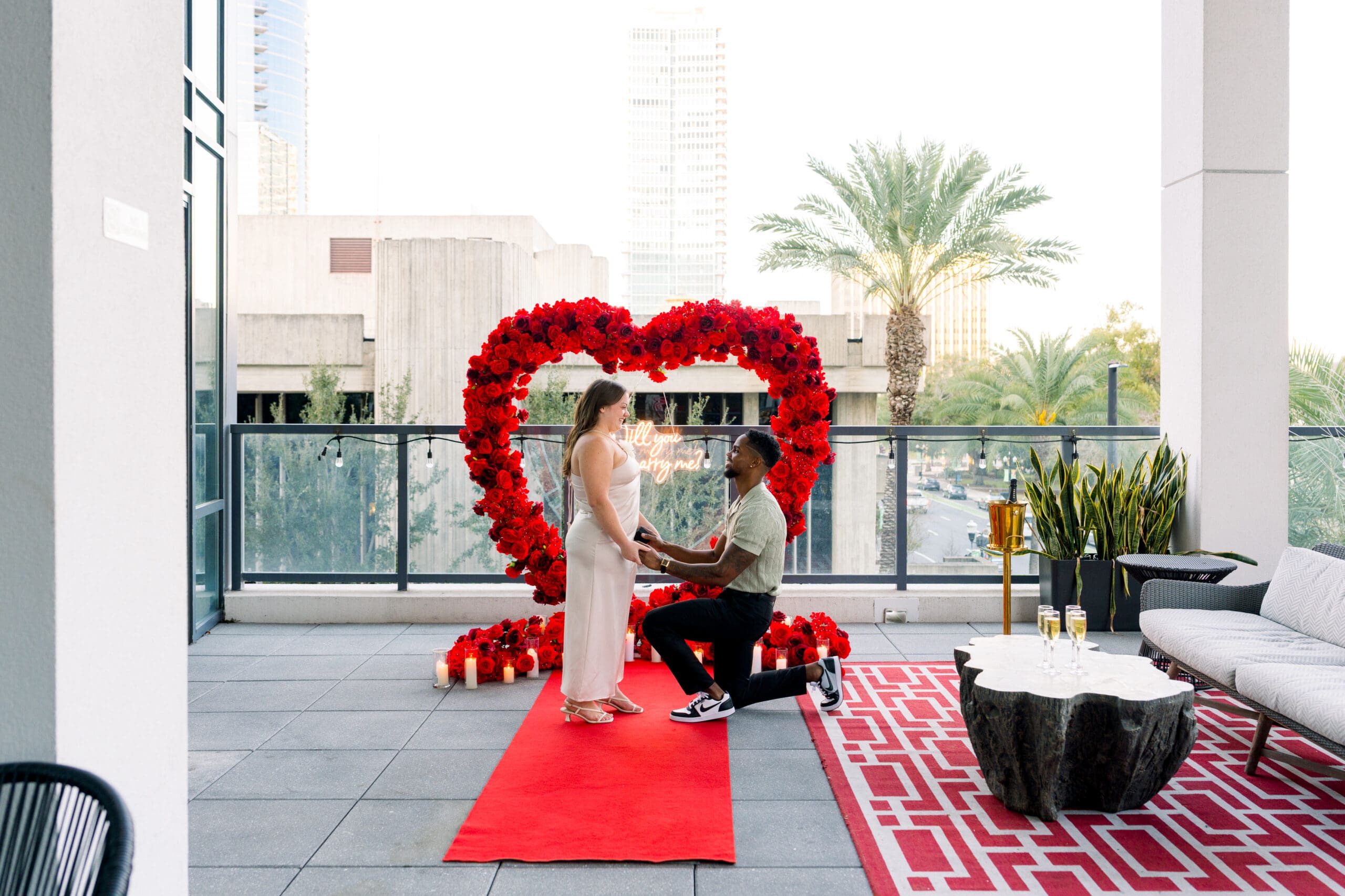 Engaged couple celebrating after a surprise proposal at Eola View