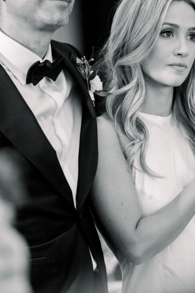 Bride and Groom Listing to speeches during their reception.