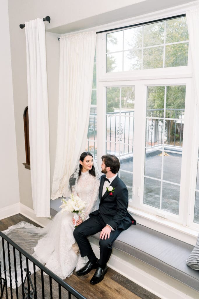 Orlando Micro wedding photographer capturing couple by a window