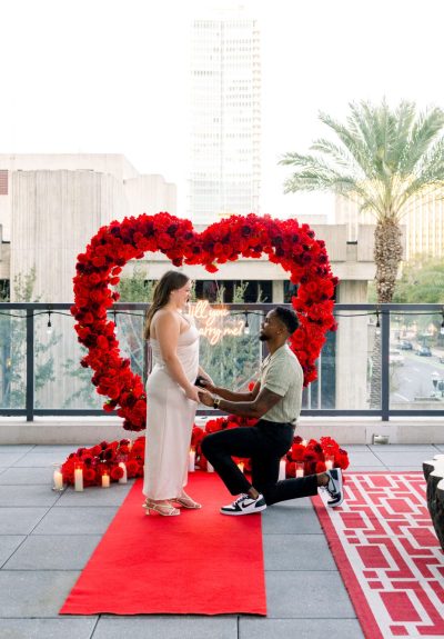 Engaged couple celebrating after a surprise proposal at Eola View