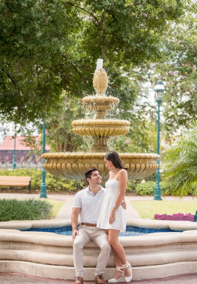 Engagement session of a couple in front of a fountain in Orlando, captured by Jerzy Nieves Photography