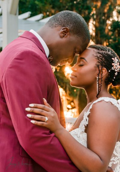 Close-up of the couple embracing under the walkway at Lake Mary Event Center