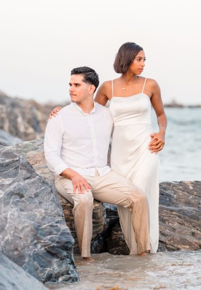 Marissa laughing during engagement photos at Jetty Park Beach in Cocoa, FL